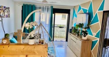 vente d'un appartement t3 (58 m²) à manapany les bains, idéal pour investissement avec terrasse et jardin.