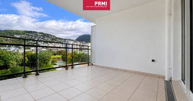 saint-denis centre : appartement t2 avec grande varangue, vue montagne et parking sécurisé